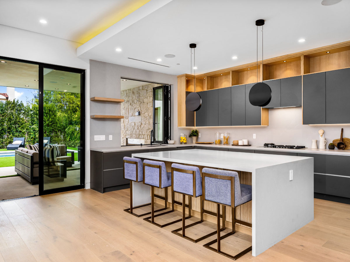 Modern kitchen extension with pendant lights and bifold doors