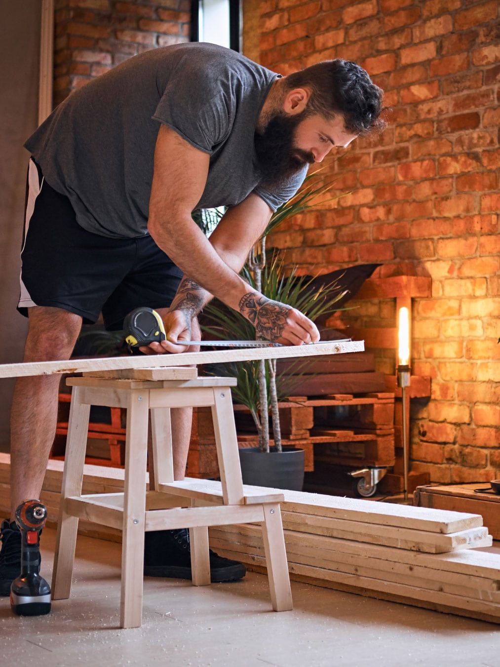 Craftsman fitting a handmade oak kitchen cabinet