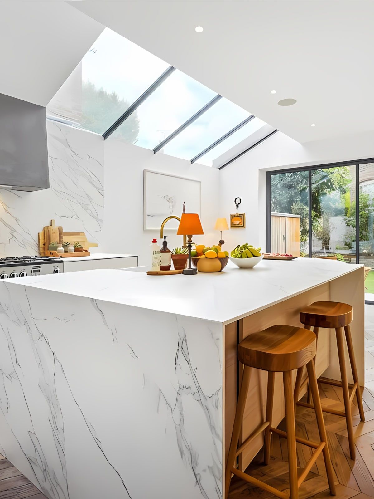Modern kitchen extension with glass roof and marble island